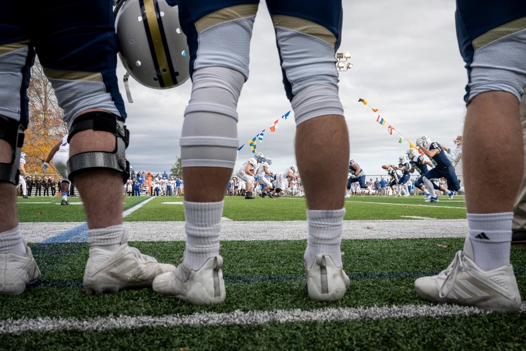 Football players lined up on the field before a play